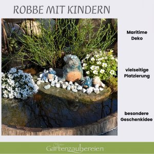 Seehund gerade mit Kindern und Dekosteinen