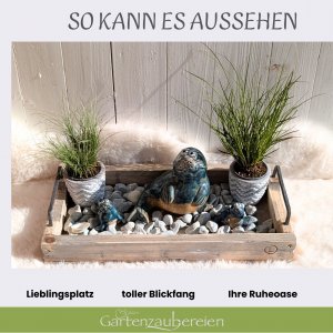 Seehund gerade mit Kindern und Dekosteinen